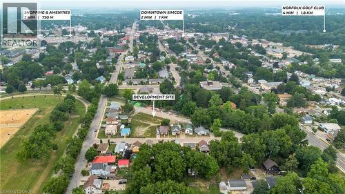 Aerial perspective showcasing a development site amidst a surrounding urban landscape and natural elements - 9 James Street, Simcoe, ON 