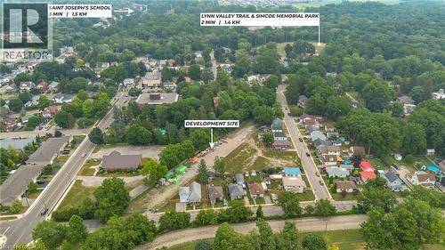 Aerial overview of a development site surrounded by established residential areas and mature tree cover - 9 James Street, Simcoe, ON 