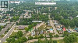 Aerial overview of a development site surrounded by established residential areas and mature tree cover - 