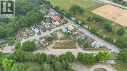 Expansive residential lot featuring a cleared building envelope, surrounded by mature trees and established neighborhood homes - 
