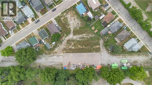 Expansive cleared lot with surrounding residential properties and mature trees - 9 James Street, Simcoe, ON 