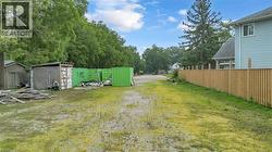 Expansive lot featuring a partial privacy fence - 