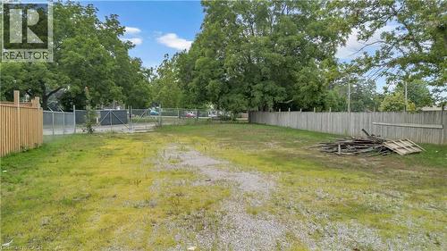 Expansive lot with a combination of gravel and grassy areas - 9 James Street, Simcoe, ON 