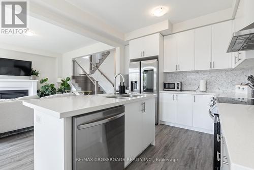 47 Ed Ewert Avenue, Clarington, ON - Indoor Photo Showing Kitchen With Fireplace With Double Sink
