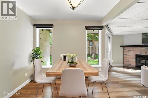 102 431 Tait Court, Saskatoon, SK - Indoor Photo Showing Dining Room With Fireplace