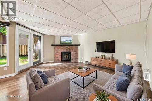 102 431 Tait Court, Saskatoon, SK - Indoor Photo Showing Living Room With Fireplace