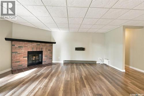 102 431 Tait Court, Saskatoon, SK - Indoor Photo Showing Living Room With Fireplace
