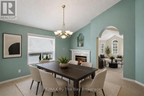 Dining Area Virtually Staged - 12 Goldsmith Place, Wasaga Beach, ON - Indoor Photo Showing Dining Room With Fireplace