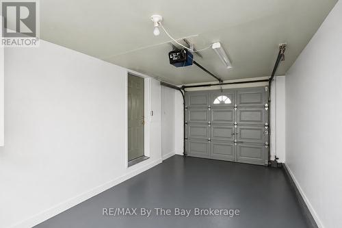 1 Car Garage with inside entrance plus person door - 12 Goldsmith Place, Wasaga Beach, ON - Indoor Photo Showing Garage