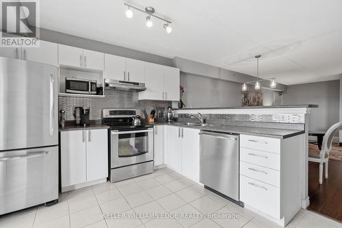 307 - 2035 Appleby Line, Burlington, ON - Indoor Photo Showing Kitchen With Double Sink