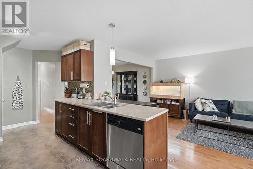 Open concept to main living areas - 617 Spikemoss Place, Ottawa, ON - Indoor Photo Showing Kitchen With Double Sink