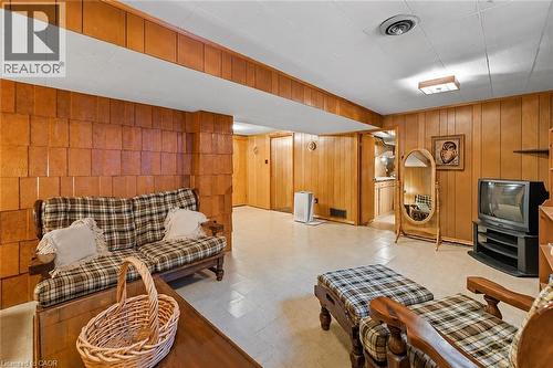 Recessed ceiling lighting complements the paneled walls in this interior space - 23 Percy Court, Hamilton, ON - Indoor Photo Showing Other Room