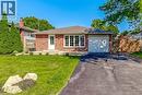 Brick-clad ranch-style residence featuring a single-car garage, white framed windows, and a paved driveway - 191 Glenmor Drive, Caledonia, ON  - Outdoor 