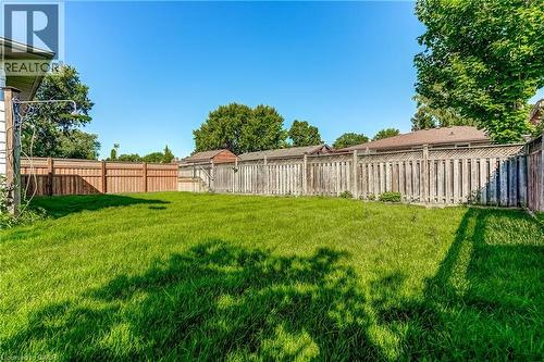 Expansive green lawn with established fencing - 191 Glenmor Drive, Caledonia, ON - Outdoor With Backyard