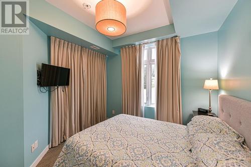 Walk out to balcony - Suite 206 - 40 Horseshoe Boulevard, Oro-Medonte (Horseshoe Valley), ON - Indoor Photo Showing Bedroom