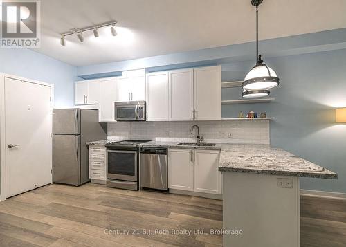 Stainless steel appliances - Suite 206 - 40 Horseshoe Boulevard, Oro-Medonte (Horseshoe Valley), ON - Indoor Photo Showing Kitchen With Upgraded Kitchen