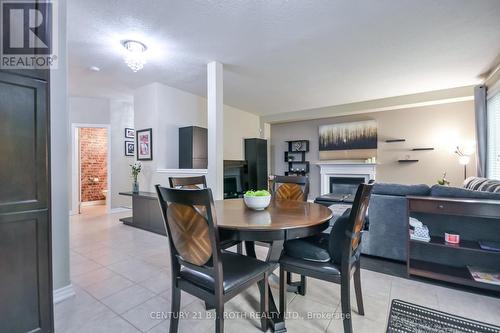 Open to family room - 20 Falcon Crescent, Barrie, ON - Indoor Photo Showing Dining Room With Fireplace