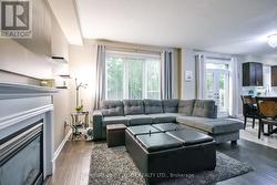 Open concept family room with gas fireplace. - 
