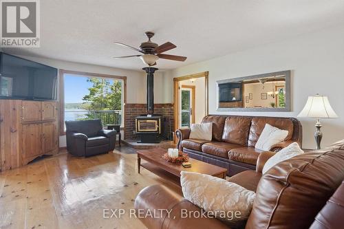 3 - 1378 Three Mile Lake Road, Muskoka Lakes (Watt), ON - Indoor Photo Showing Living Room With Fireplace