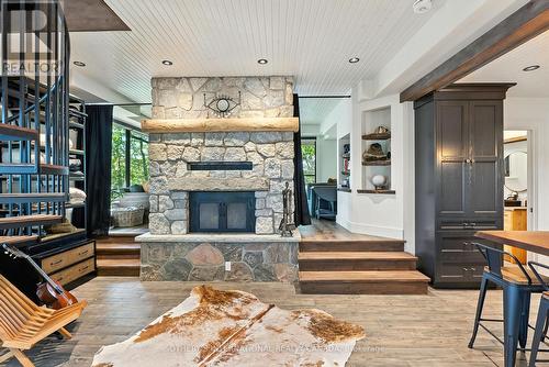 Living room of renovated cottage - 1023 Mccabe Road, Lake Of Bays, ON - Indoor With Fireplace