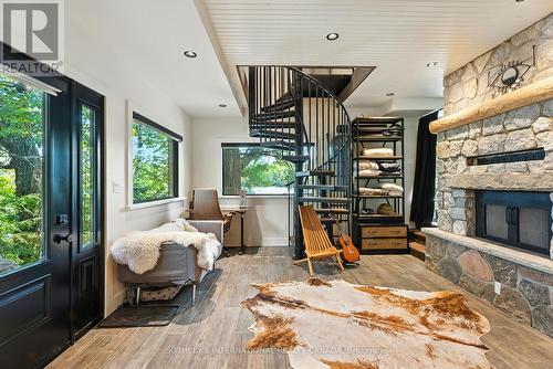 cozy fireplace seating - 1023 Mccabe Road, Lake Of Bays, ON -  With Fireplace