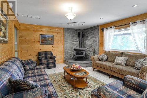1887 Ellis Road, Severn (Coldwater), ON - Indoor Photo Showing Living Room With Fireplace