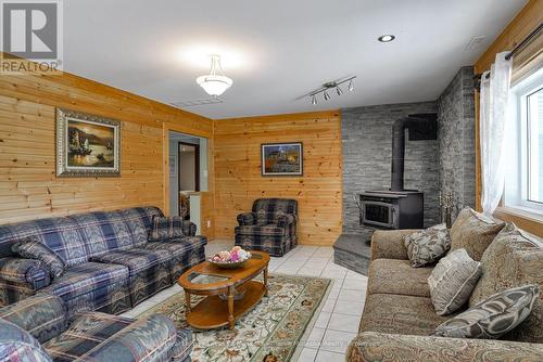 1887 Ellis Road, Severn (Coldwater), ON - Indoor Photo Showing Living Room With Fireplace
