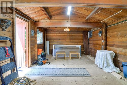 1887 Ellis Road, Severn (Coldwater), ON - Indoor Photo Showing Other Room With Fireplace