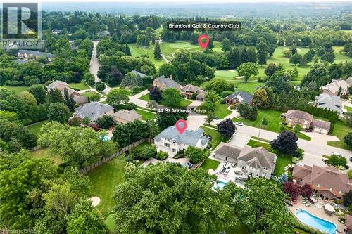 Aerial perspective showcasing a residential neighborhood with ample tree coverage - 44 St Andrew'S Drive, Brantford, ON - Outdoor With View