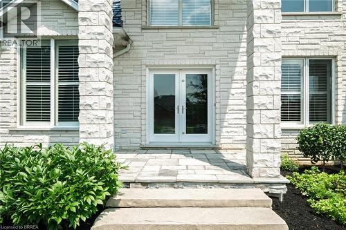 Stone veneer exterior featuring a double-door entry with glass panels - 44 St Andrew'S Drive, Brantford, ON - Outdoor