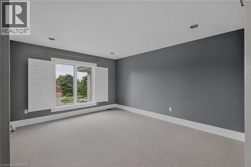 Spacious room featuring gray wall paint, light gray carpeting, and white baseboards - 44 St Andrew'S Drive, Brantford, ON - Indoor Photo Showing Other Room