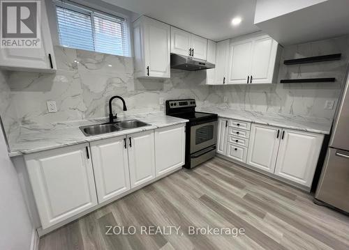 1911 Swan Street, Innisfil, ON - Indoor Photo Showing Kitchen With Stainless Steel Kitchen With Double Sink With Upgraded Kitchen