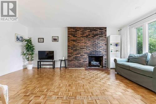 73 Hobart Crescent, Ottawa, ON - Indoor Photo Showing Living Room With Fireplace