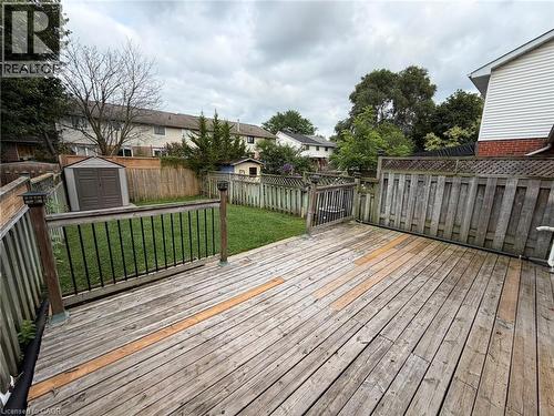 Spacious wood-finish deck with black metal balusters and post-top lighting - 41 Edgemere Drive, Cambridge, ON - Outdoor With Deck Patio Veranda With Exterior