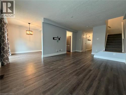 Spacious interior featuring wood-finish flooring throughout - 41 Edgemere Drive, Cambridge, ON - Indoor