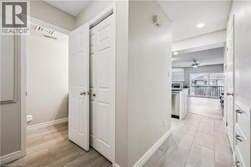 Hallway with light gray walls, white trim, and light gray tile flooring - 711 Johnston Park Avenue, Collingwood, ON - Indoor Photo Showing Other Room