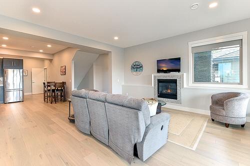 1-6267 Sundstrom Court, Peachland, BC - Indoor Photo Showing Living Room With Fireplace