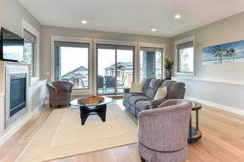 1-6267 Sundstrom Court, Peachland, BC - Indoor Photo Showing Living Room With Fireplace