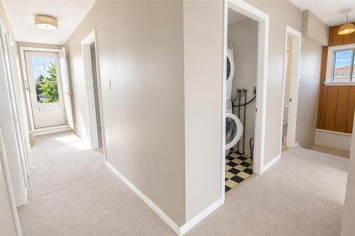 Laundry, hallway to bedrooms and rooftop. - 67 Park Avenue, Lac Du Bonnet, MB 