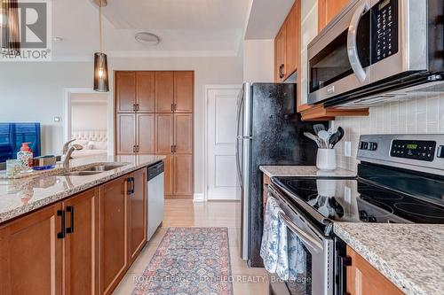 1806 - 100 John Street, Brampton, ON - Indoor Photo Showing Kitchen With Double Sink