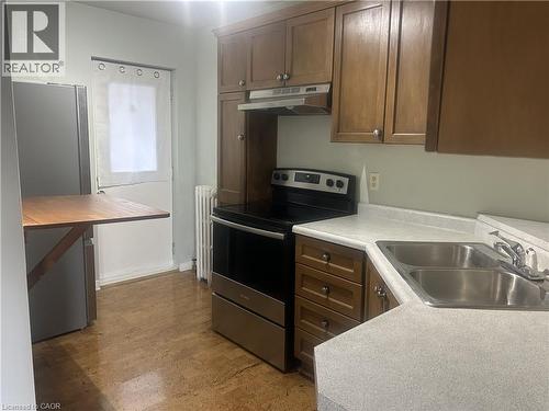 352 Hunter Street E Unit# 4, Hamilton, ON - Indoor Photo Showing Kitchen With Double Sink