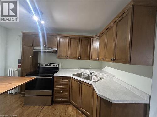352 Hunter Street E Unit# 4, Hamilton, ON - Indoor Photo Showing Kitchen With Double Sink