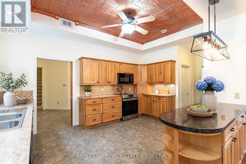 Virtually Staged - 105 Copeland Creek Drive, Tiny, ON - Indoor Photo Showing Kitchen With Double Sink