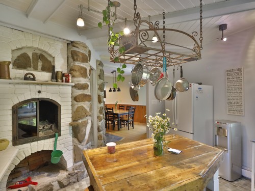 Kitchen - 1001 Ch. Du Lac N., Sainte-Mélanie, QC - Indoor With Fireplace