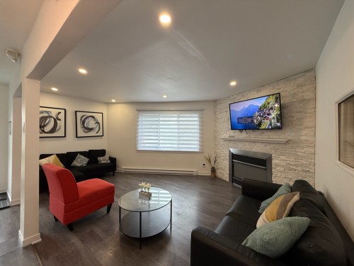 Salon - 299 Rue De La Reine, Laval (Auteuil), QC - Indoor Photo Showing Living Room With Fireplace