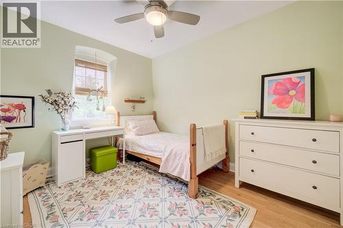 Hardwood flooring with a decorative area rug - 314 Glasgow Street, Kitchener, ON - Indoor Photo Showing Bedroom