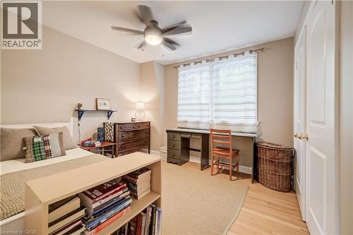 Bedroom featuring hardwood flooring, a ceiling fan, and painted walls - 314 Glasgow Street, Kitchener, ON - Indoor