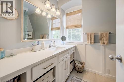 Vanity area featuring a wide countertop, integrated sink, and white cabinetry with brushed nickel hardware - 314 Glasgow Street, Kitchener, ON - Indoor Photo Showing Bathroom