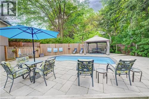 Expansive paver patio surrounding a rectangular in-ground swimming pool - 314 Glasgow Street, Kitchener, ON - Outdoor With In Ground Pool With Deck Patio Veranda