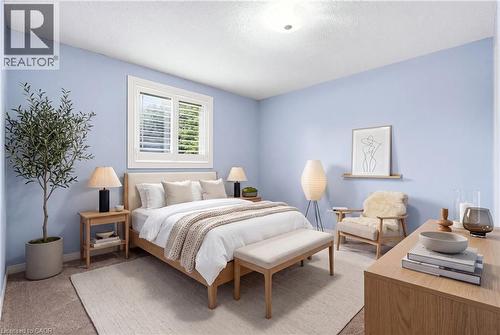 Room featuring light blue walls and neutral carpeting - 19 Alona Avenue, Cambridge, ON - Indoor Photo Showing Bedroom